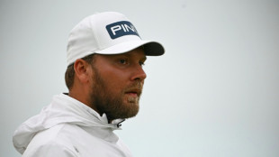 Brown takes shock British Open lead as McIlroy, Woods suffer nightmare starts