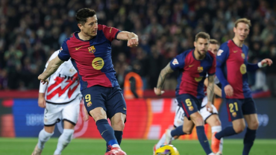 Lewandowski lifts Barcelona past Rayo and into Liga lead