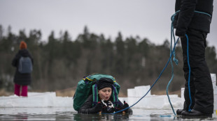 Swedish kids take the plunge in icy lake survival lessons