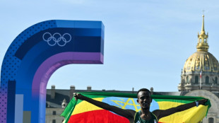 Ethiopia's Tola wins Olympic marathon as China sweeps diving golds