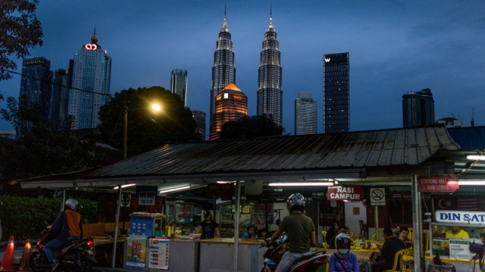 Malaysia central bank hikes interest rate to tame inflation