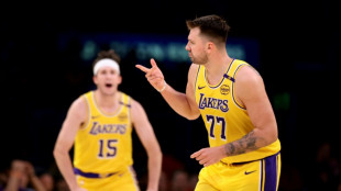 Doncic leads Lakers romp over Nuggets, Kings upset Cavs 