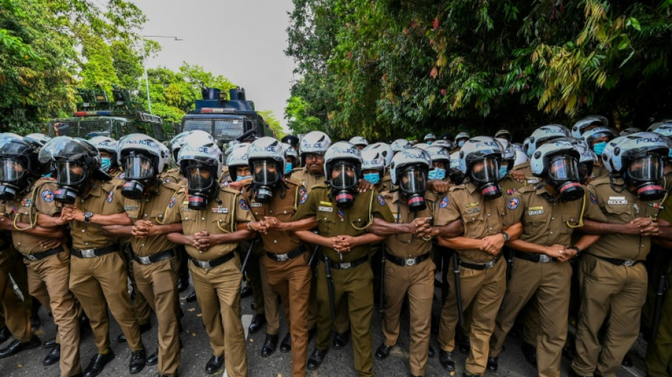 Sri Lanka police tear gas student protesters outside parliament