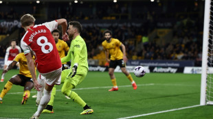 Arsenal grind out Wolves win to go top of Premier League