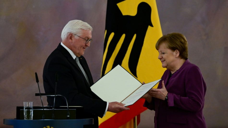 Merkel given Germany's top honour despite criticism