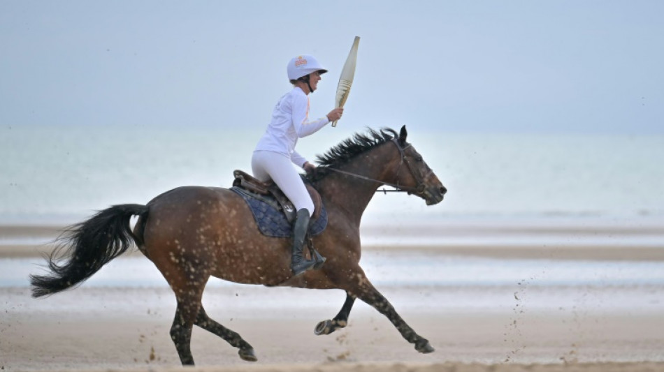 Olympic torch lights up France ahead of the Paris Games 