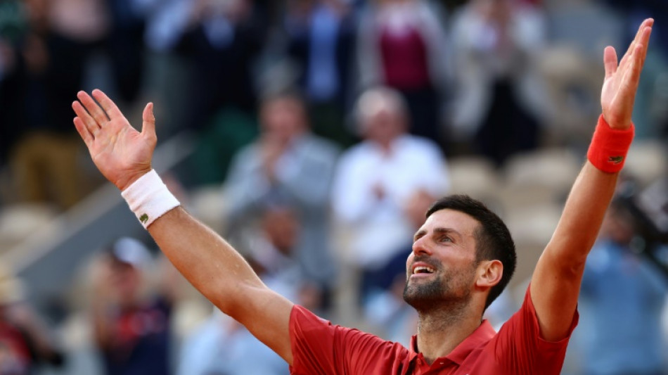 Djokovic into French Open quarter-finals after five-set thriller