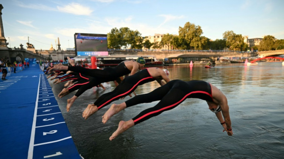 Swimmers plunge in the Seine as gender row boxer eyes gold