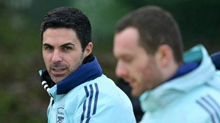 Arteta consulting Arsenal players during striker search